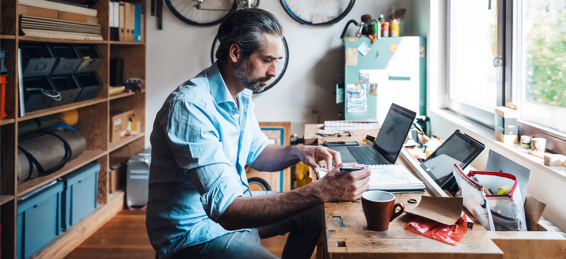 A person sitting at a desk with a computer researching ABN loans