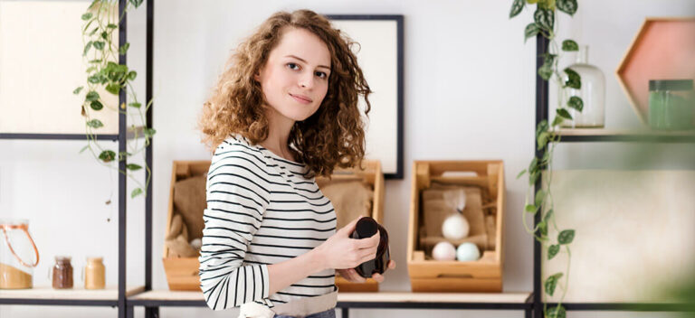 woman in retail shop thinking about the cash conversion cycle