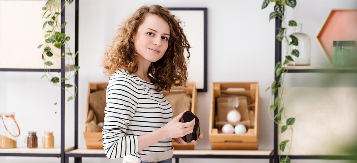 woman in retail shop thinking about the cash conversion cycle