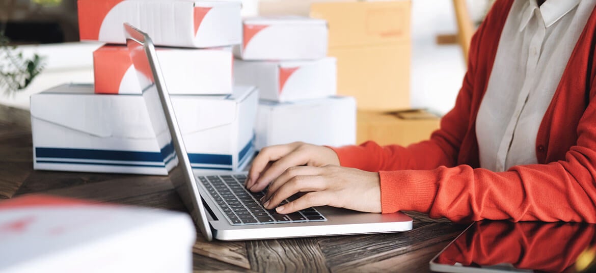 Picture of woman at computer looking at cash flow finance