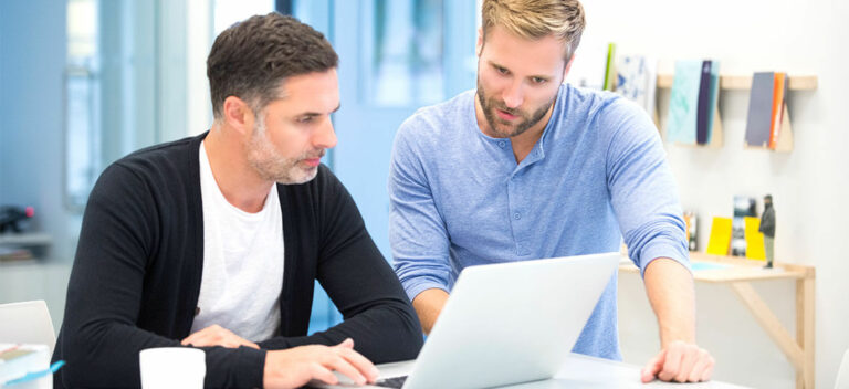 two business managers viewing a cash flow forecast