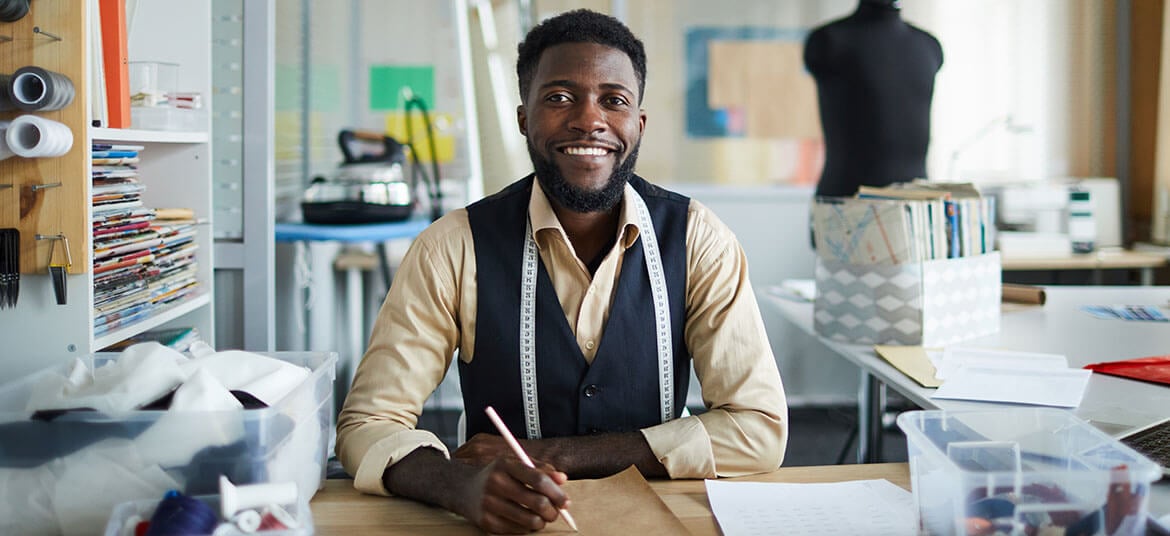 Man calculating gross profit and net profit for his small business