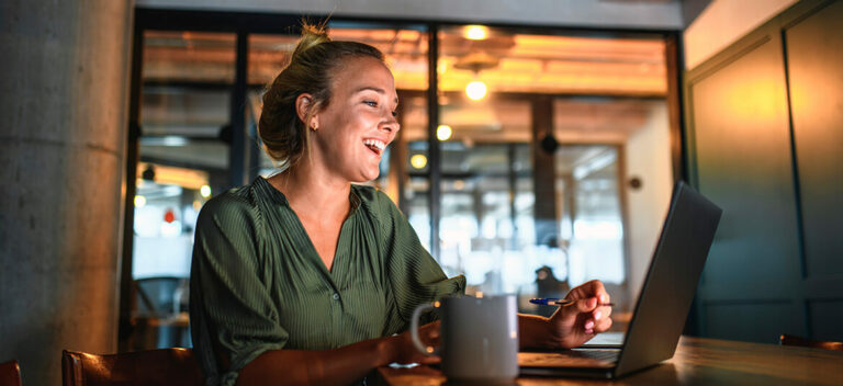women at laptop engaging in asynchronous communication