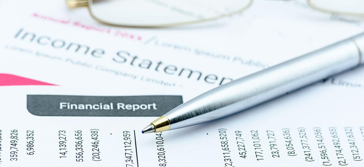showing income statement with pen, also called a profit and loss statement