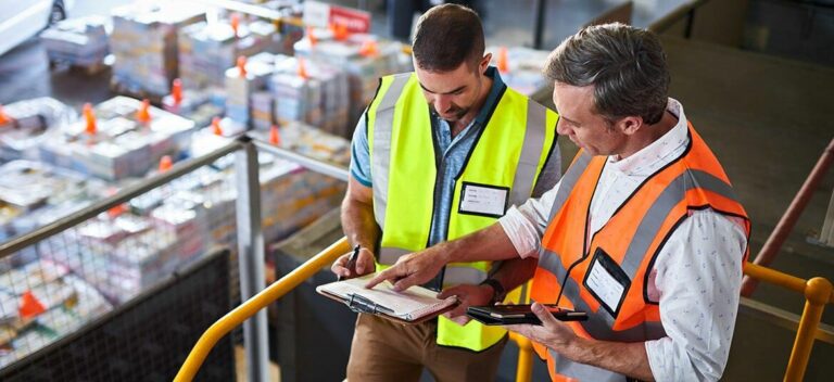 two men in warehouse considering trade finance options