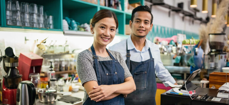 Small business owners in their cafe.